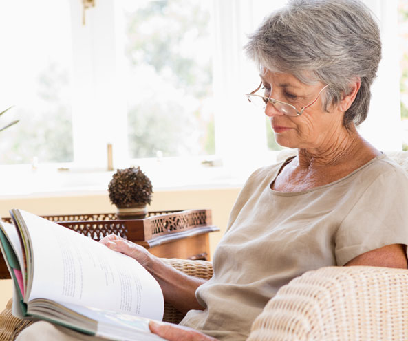 Elderly woman reading.
